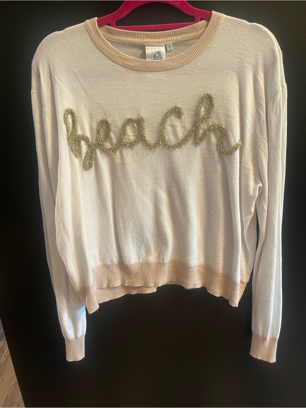 QUEEN OF SPARKLES Cream Pullover with Gold 'Beach' Script